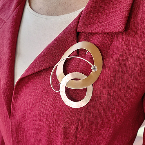 close-up shot of a brooch on formal clothing